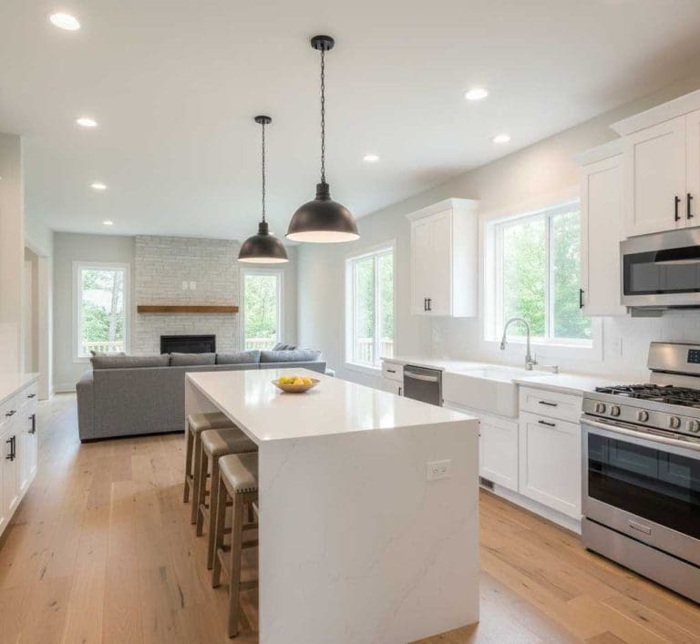 Modern kitchen renovation ideas Nashville 2026 featuring white shaker cabinets and quartz waterfall island
