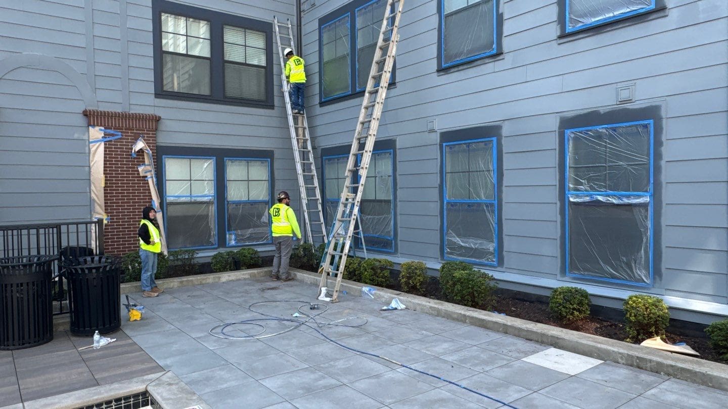 Crew working on a multifamily building exterior renovation